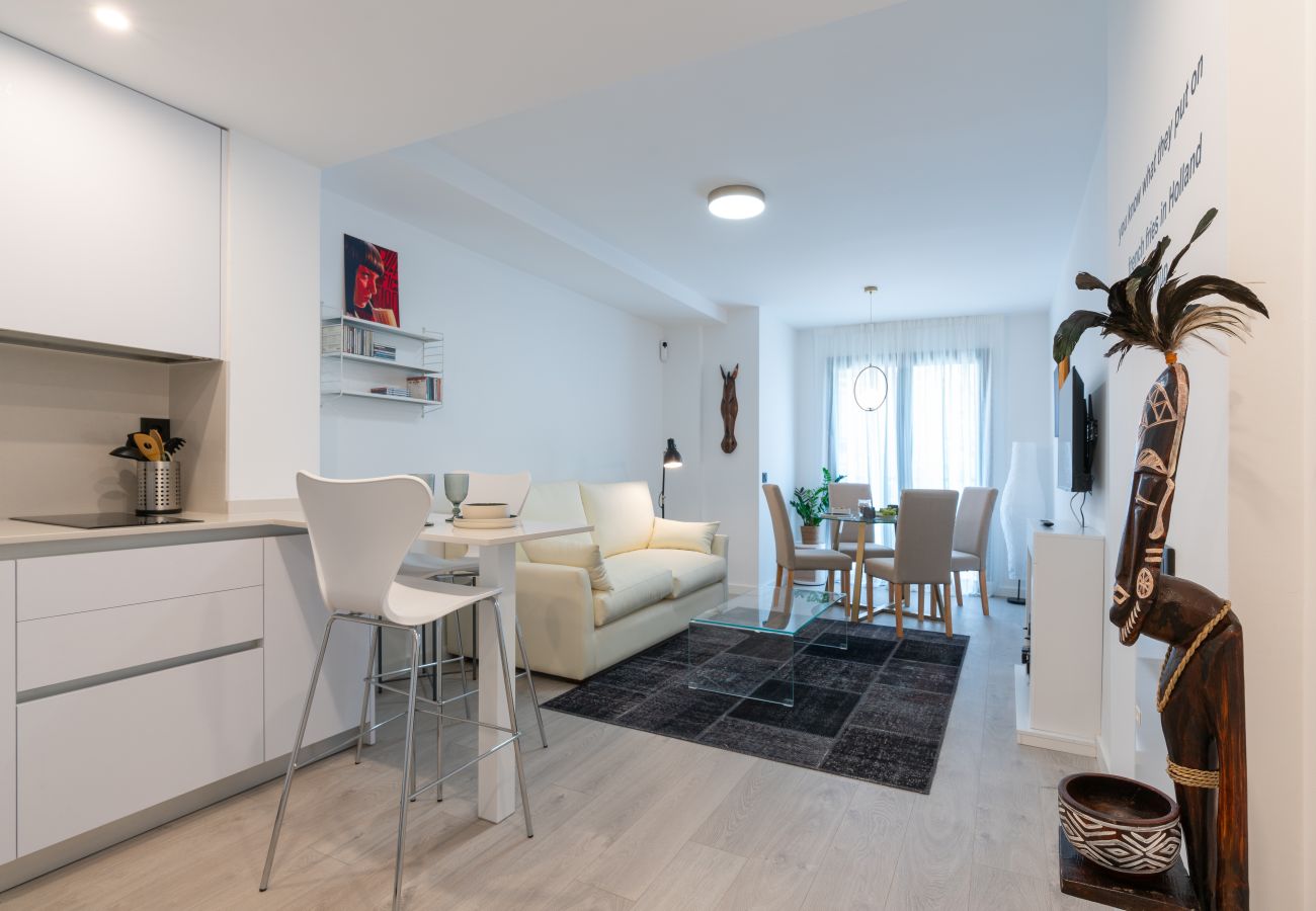 View of the living room of 1-bedroom apartment down-town Málaga with a Pulp Fiction theme